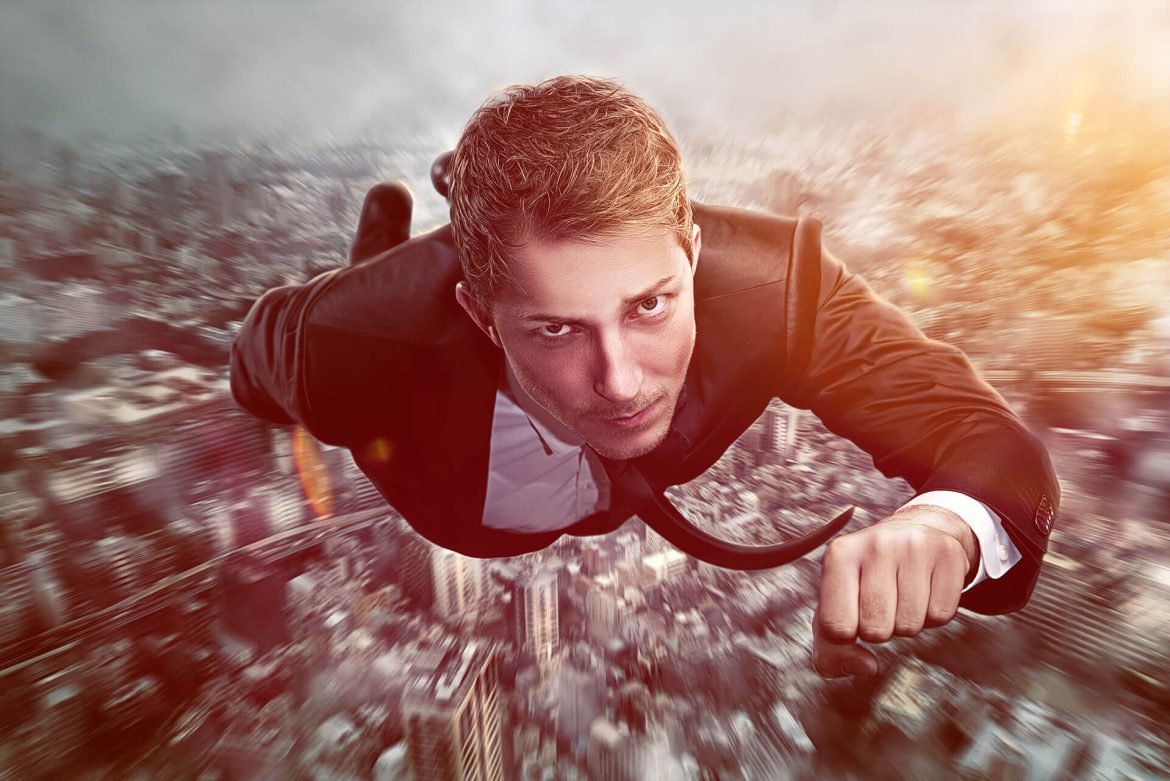 business+man+flying+above+city