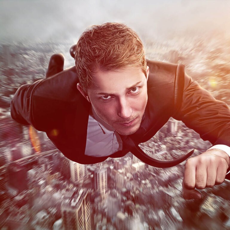 business+man+flying+above+city